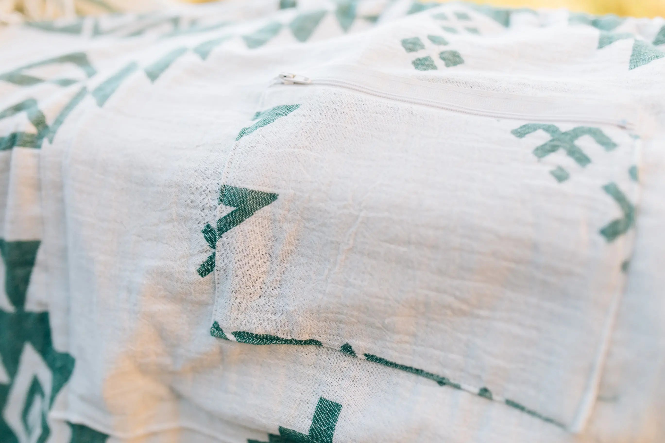 cream and green zipper pocket on beach towel , convertible beach bag 