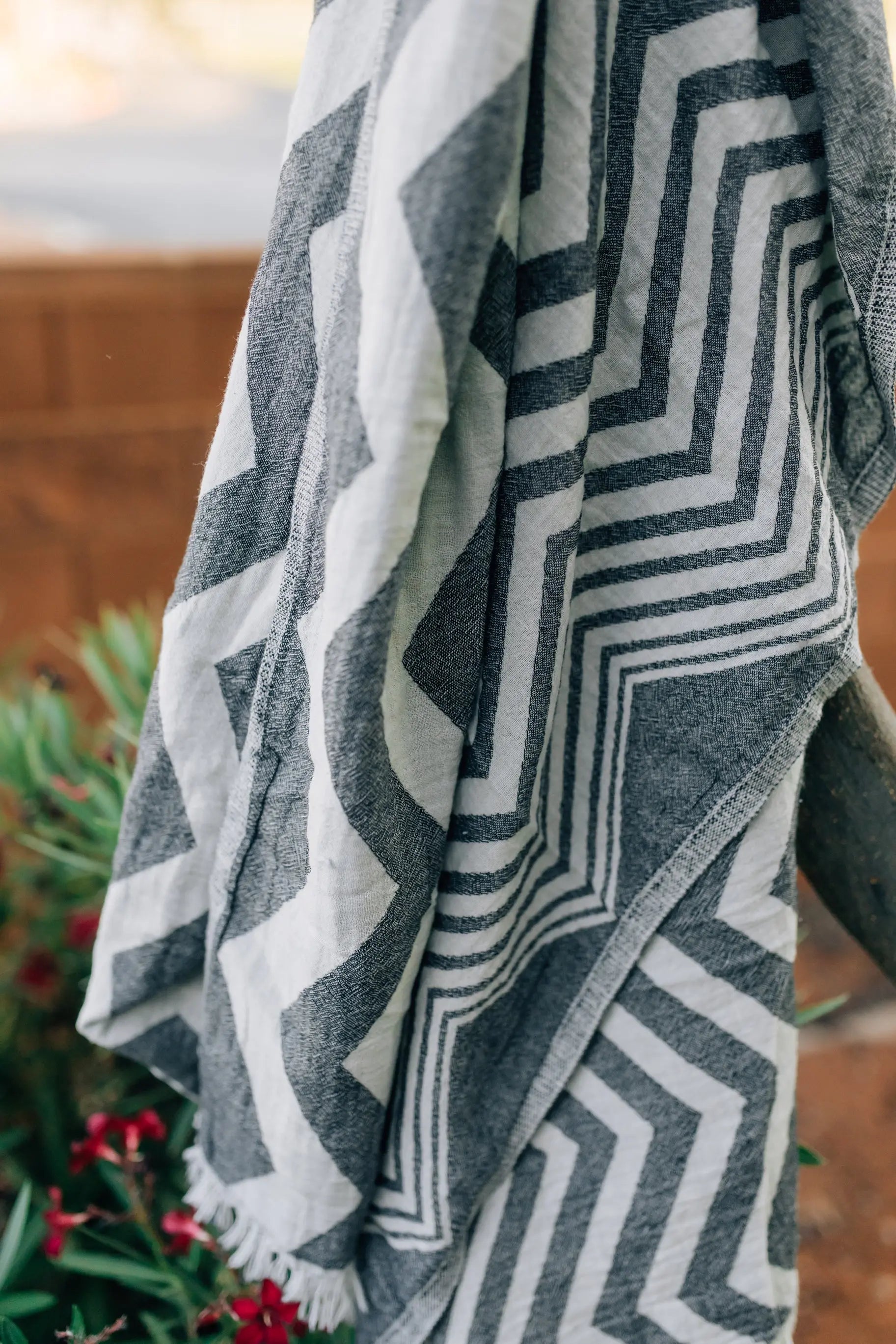 black gray turkish towel hanging in tree - hawaii- sand free beach towel 
