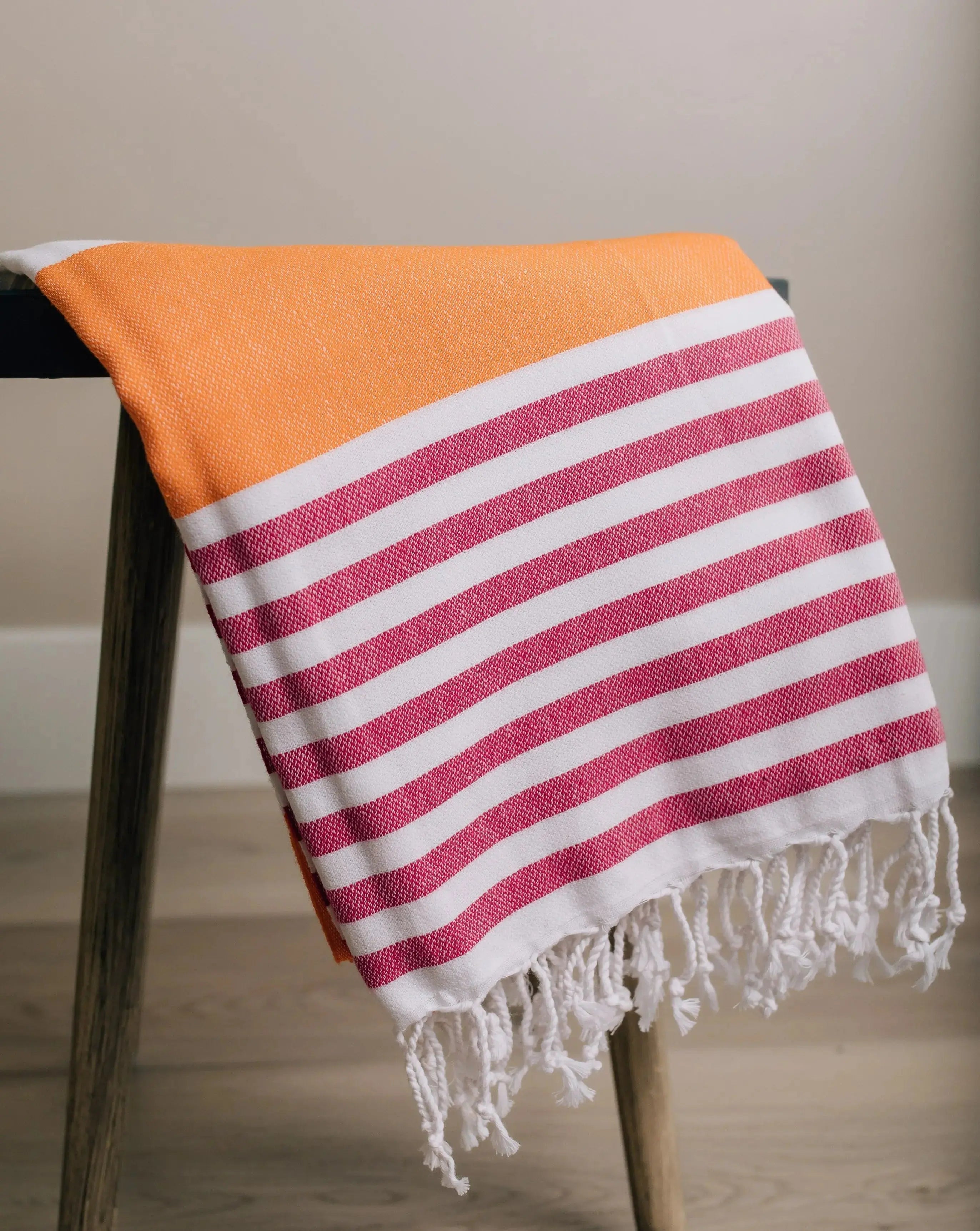 cabana print turkish towel . orange and hot pink stripe with  tassels 