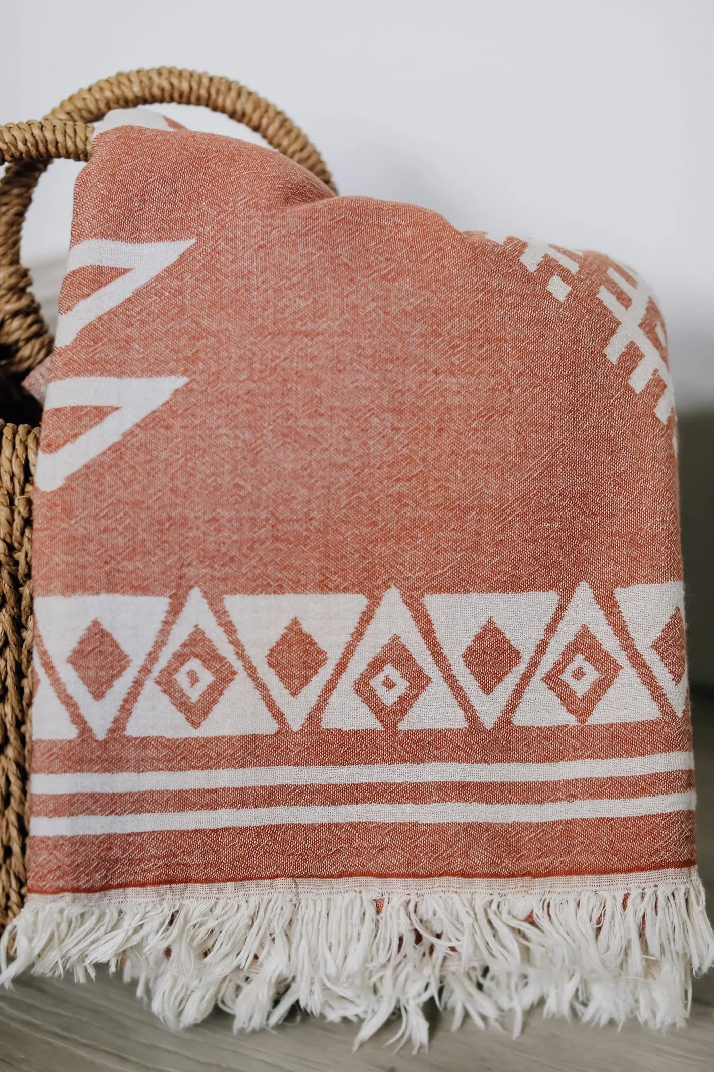 diamond pattern beach towel in beach bag 
